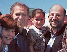 Slug: St/Alarian Deadline: 7/23/02 Contact: Dr. Al-Arian. Cell phone is 813-300-9393. We have permission to use. caption: Sami Al-Arian, holding daughter Lama, 6, center, with son Abdullah, 19, left, daughter Laila, 18, foreground left, daughter Leena, 14, center, wife Nahla, center right, and son Ali, 9, foreground left, pose for a photo with presidential candidate George W. Bush and wife Laura in this March 12, 2000 family photo in Plant City, Fla. Others, extreme right, are unidentified. (AP Photo/Sami Al-Arian) ORG XMIT: FLSM101